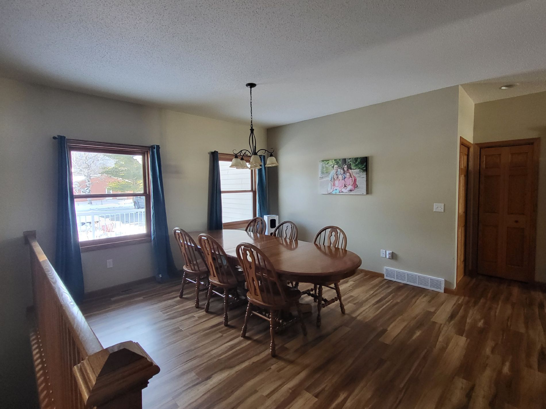 Dining room, with garage entrance and laundry room to the rear, plus kitchen pantry to the right.