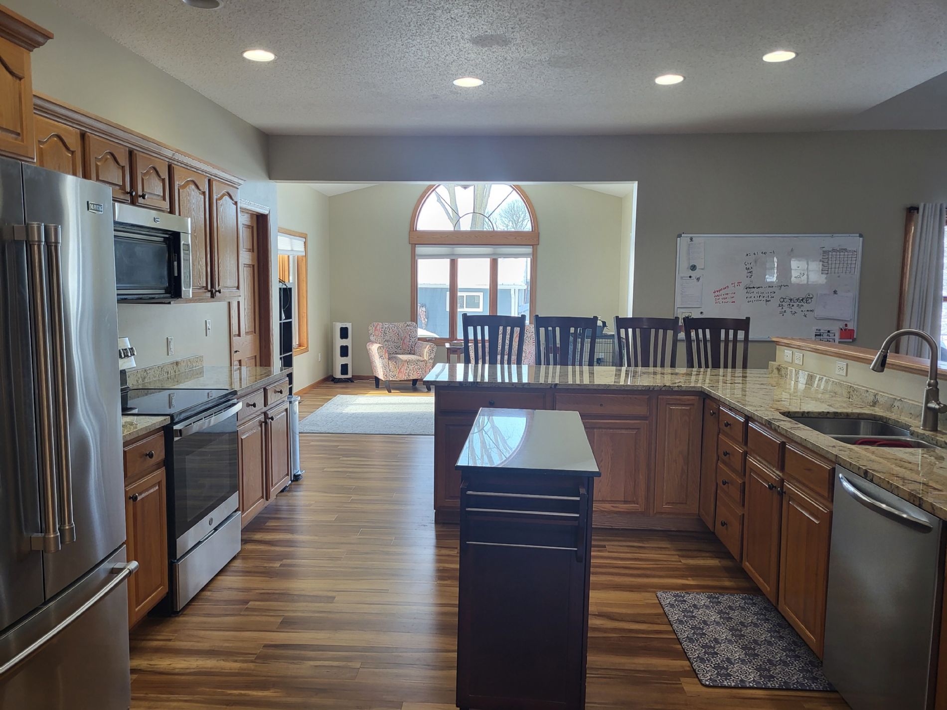 Kitchen view in the other direction into the sitting/study/alternate dining room.